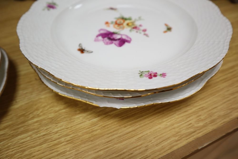 A set of eight Berlin plates, decorated with butterflies and flowers, diameter 21cm (5) and 24cm (3)